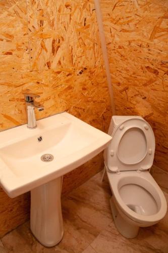 a bathroom with a sink and a toilet at Hill sunny2024 in Zemo Jocho