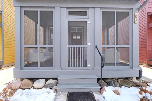 a screened in porch with sliding glass doors at Just a Little Longer in Ottawa