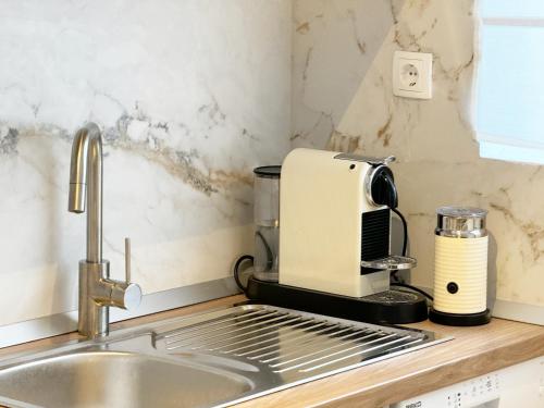a coffee maker sitting on top of a kitchen counter at Casa Faria in Stari Grad