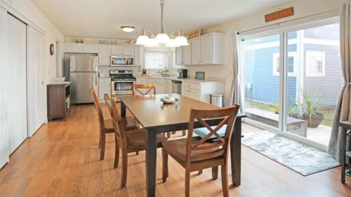 a kitchen and dining room with a table and chairs at Splash Haven in Ottawa