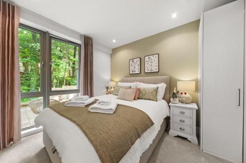 a bedroom with a large bed and a window at Springfield Fourteen in Harrogate