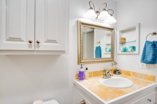 a bathroom with a sink and a mirror at Cozy Telluride Condo Near Ski Resort and Hiking in Telluride