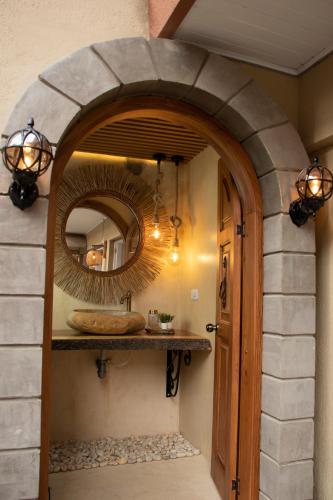 a bathroom with a sink and a mirror at Marbore hotel & Spa in Bogotá