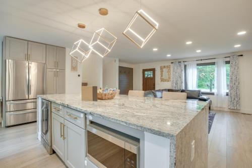 a kitchen with a large island with a counter top at Spacious Riverfront Delaware Home with Views in Delaware