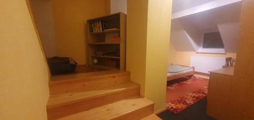 a room with a staircase leading to a bedroom at Lhotka Kopeček in Žďár nad Sázavou
