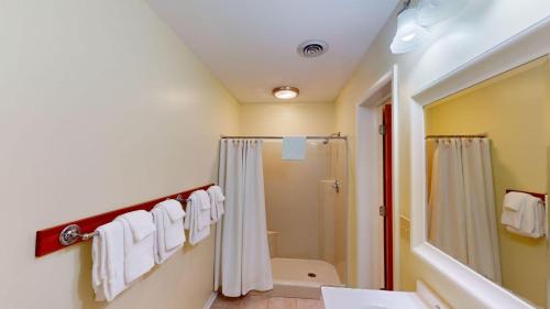 a bathroom with a shower curtain and a sink at Beach and Golf Dreams: 3 Bedroom 2 Bath in Pawleys Island