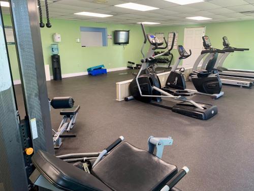 a gym with several treadmills and cardio machines at Pet friendly tiny home, No extra fees! The Jitney in Clermont