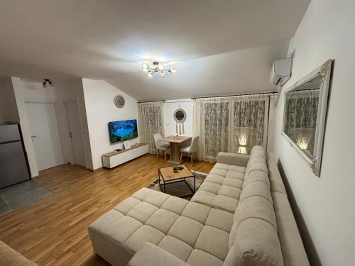 a living room with a couch and a table at KIA APARTMENT 2 in Valjevo