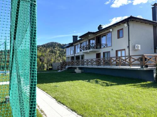a view of a house from behind a fence at Villa Sarajevo in Vareš