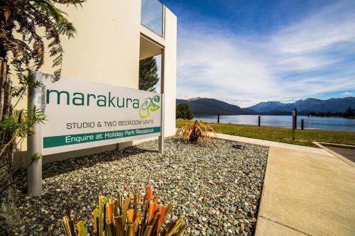 a sign for a school in front of a building at Marakura Deluxe Motel in Te Anau