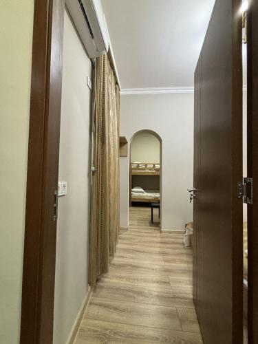 a hallway with a hallway leading to a bedroom at New Meidan in Tbilisi City
