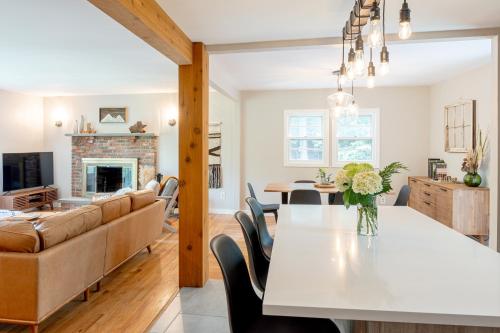 a kitchen and living room with a table and a couch at Modern Rustic Escape w/Hot Tub - High Falls Lodge in Saugerties