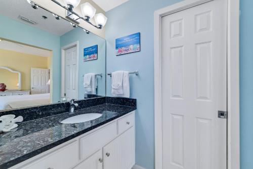 a bathroom with a sink and a mirror at Phoenix 5 Unit 1417 in Orange Beach