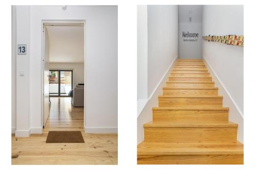 a staircase in a home with white walls and wood floors at Belem Design Apartments by Homing in Lisbon