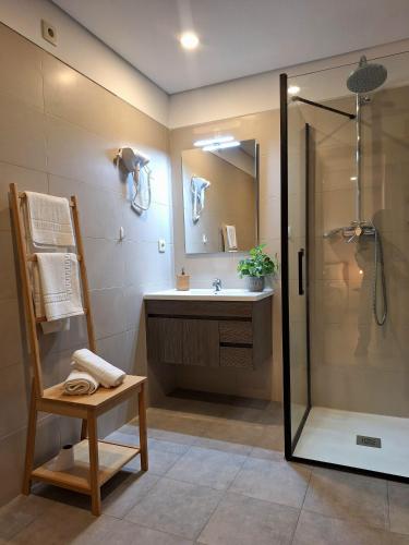 a bathroom with a shower and a sink at Villa Ribeiro in Vila Praia de Âncora