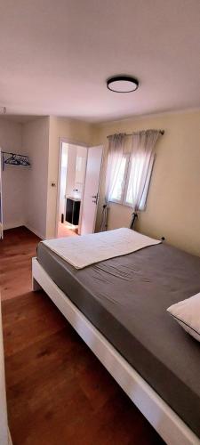 a bedroom with a large bed in a room at Villa Romantica in Blato