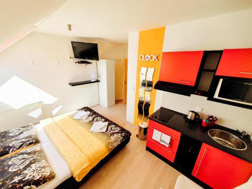 a bedroom with a bed and a sink in it at Penzion Patriot in Výprachtice