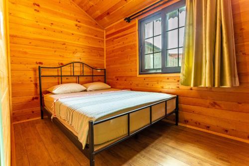 Postel nebo postele na pokoji v ubytování Izgen Bungalows