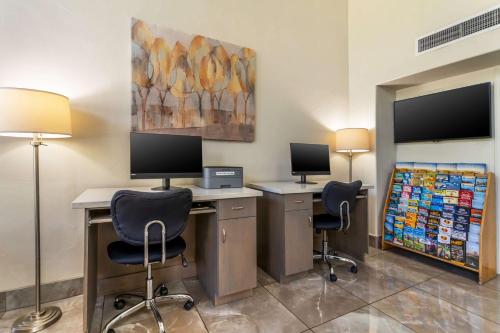 an office with two desks with two monitors and two chairs at Best Western Plus Inn Scotts Valley in Scotts Valley