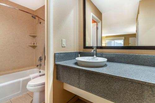 a bathroom with a sink and a toilet and a mirror at Best Western Plus Inn Scotts Valley in Scotts Valley