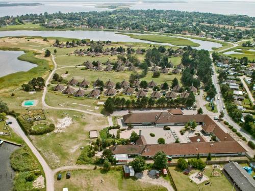 an aerial view of a village next to a river at 4 person holiday home on a holiday park in Karreb ksminde in Karrebæksminde