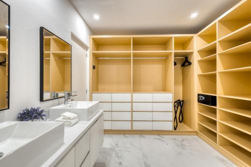 a bathroom with a sink and a mirror at Marea Los Cabos Albatros 202 in Cabo San Lucas