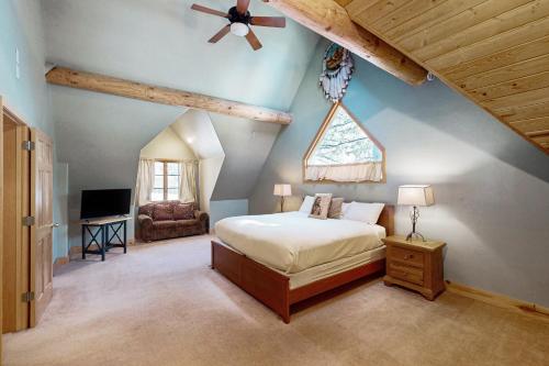 a bedroom with a bed and a ceiling fan at Marshall Haven in South Lake Tahoe