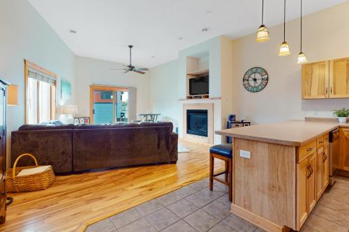 a kitchen and living room with a couch at Lake Minocqua Lakeview in Minocqua