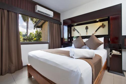 Kama o mga kama sa kuwarto sa Fiji Gateway Hotel