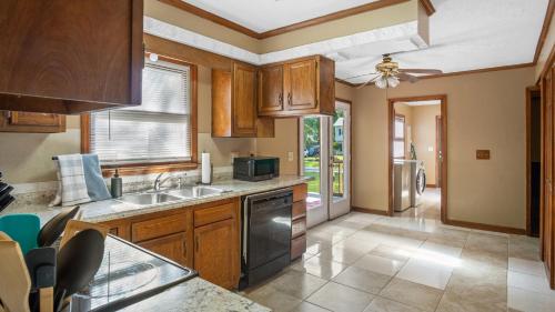 a kitchen with a sink and a stove at 4bd Contemporary Home with BBQ, Game Room in Charlotte