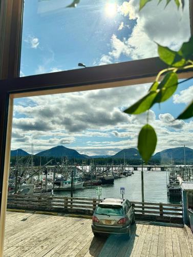 a view of a marina with a car parked on a deck at Inn At Creek Street in Ketchikan