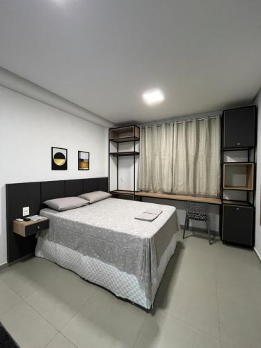 Ένα ή περισσότερα κρεβάτια σε δωμάτιο στο Studio Estilo Industrial 02