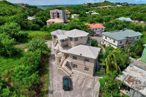 an aerial view of a house with a car parked in front at Homely 2 bedroom in Morne Rouge