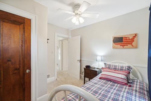 a bedroom with a bed and a ceiling fan at Exclusive Ottawa Hills Private Home, Garage, WD, Gourmet Equipped kitchen, Netflix in Ottawa Hills