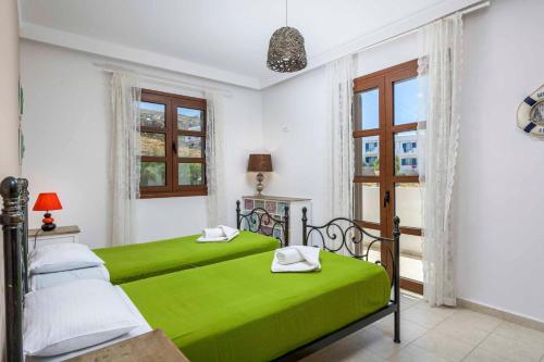 A bed or beds in a room at Lindos Emerald