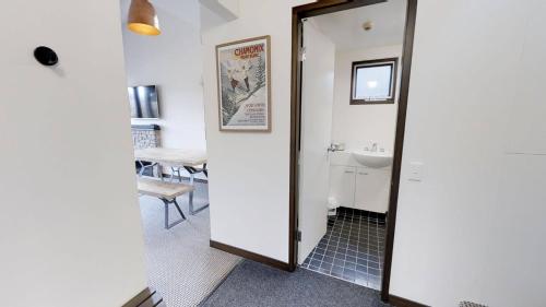 a bathroom with a mirror and a sink at Studio Loft 9 The Stables Perisher in Perisher Valley