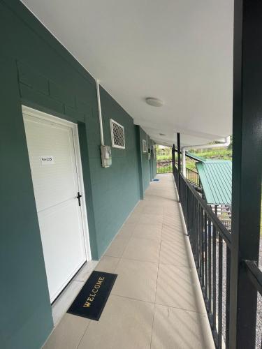 a hallway of a house with a white door at Moalela'i Accommodation in Apia