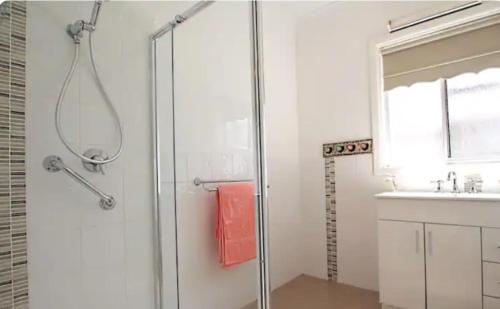 a bathroom with a shower and a sink at The Warrnambool Wharf House in Warrnambool