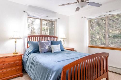 a bedroom with a bed and a ceiling fan at Cross Creek - Pool and Hot Tubs by Daniel in Frisco