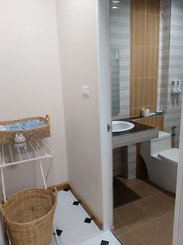 a bathroom with a sink and a toilet at P2 Location pool villa in Ban Pak Chong