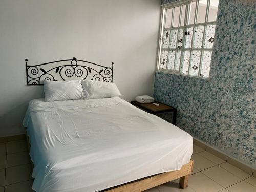Katil atau katil-katil dalam bilik di Nice house Casa de Descanso en San Andrés Tuxtla.