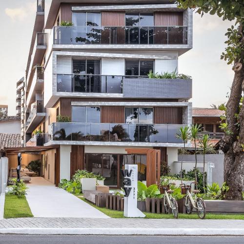 an apartment building with bikes parked in front of it at Way Bossa by Solis in João Pessoa