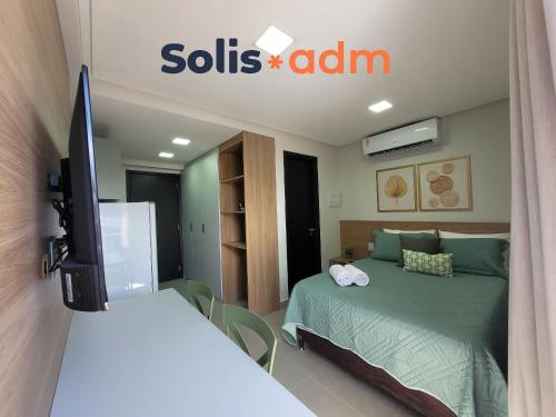 a bedroom with a bed and a sills alarm sign at Way Bossa in Tambaú