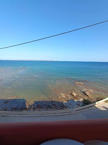 a view of the ocean from inside a vehicle at Nisaki chios apartments in Agia Ermioni