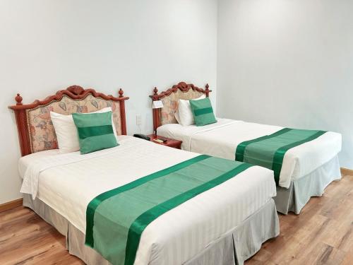 Ένα ή περισσότερα κρεβάτια σε δωμάτιο στο Riverside Hotel Saigon