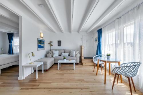 a living room with a couch and a table at The Ocean Resort Inn in Montauk