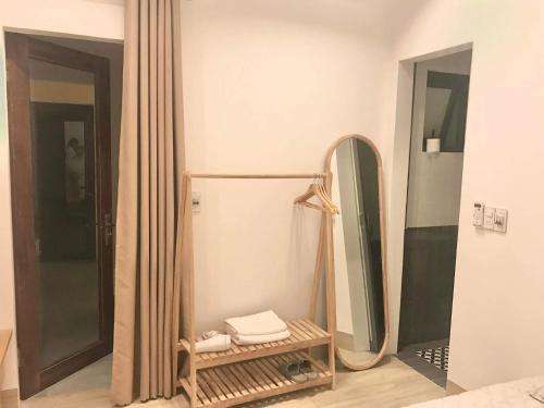a dressing room with a mirror and a dressing table at Pamela Homestay Cao Bằng in Cao Bằng