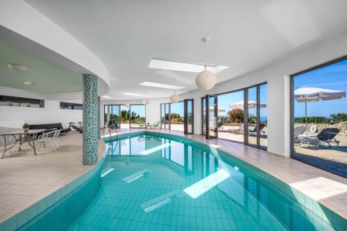 a swimming pool in a house with a view of the ocean at Rhodes Kallithea Villa - Zafira Private Pool Gem in Kallithea Rhodes