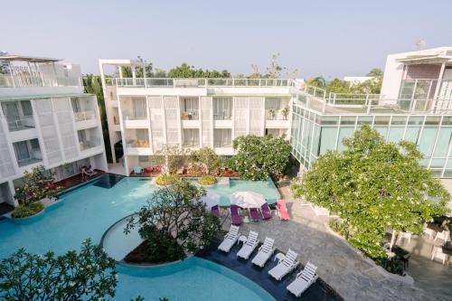 an overhead view of a hotel with a pool and chairs at The Sea Cret Hua Hin in Hua Hin