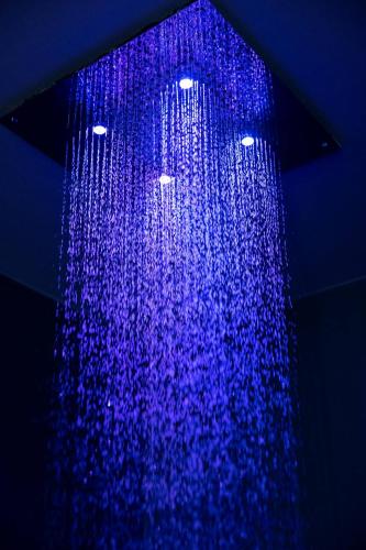 a blue shower hanging from a ceiling at Dimora Santa Rosalia in Alba